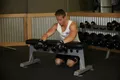 Curl poignets haltères pronation sur banc
