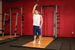 Extension triceps haltère un bras debout
