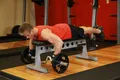 Rowing barre cambré allongé