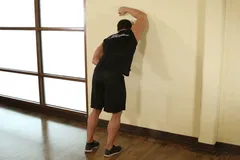 One Arm Against Wall