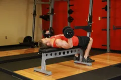 Curl haltères allongé sur le dos