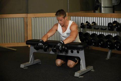 Curl poignets haltères pronation sur banc