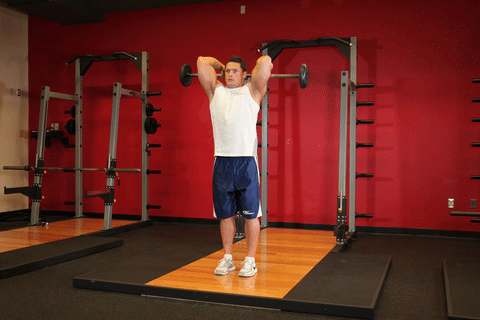 Extension triceps barre overhead debout